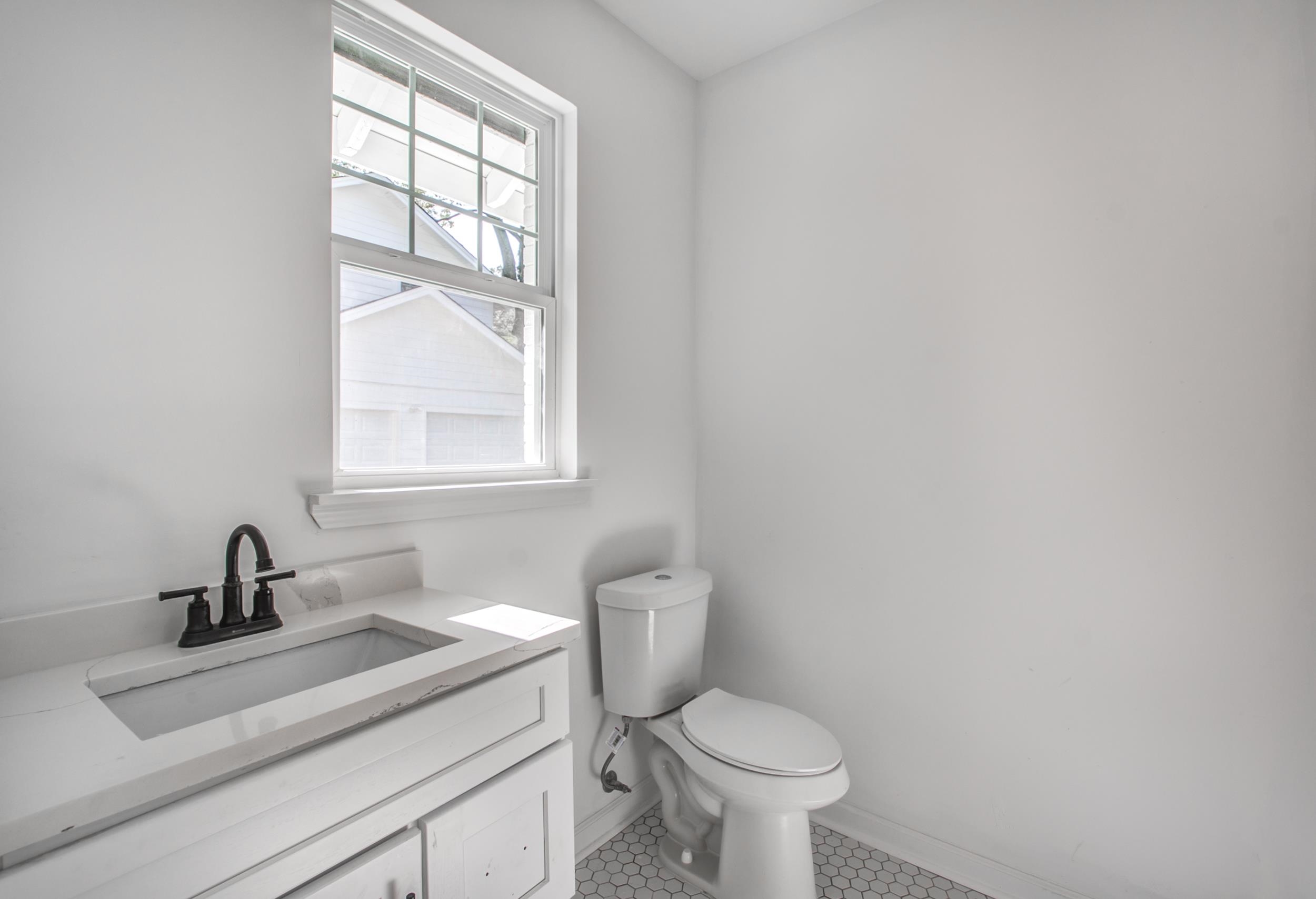 1781 Forest Avenue Memphis, TN 38112 - Photo 16 of 30 Half bathroom with vanity and light tile patterned flooring