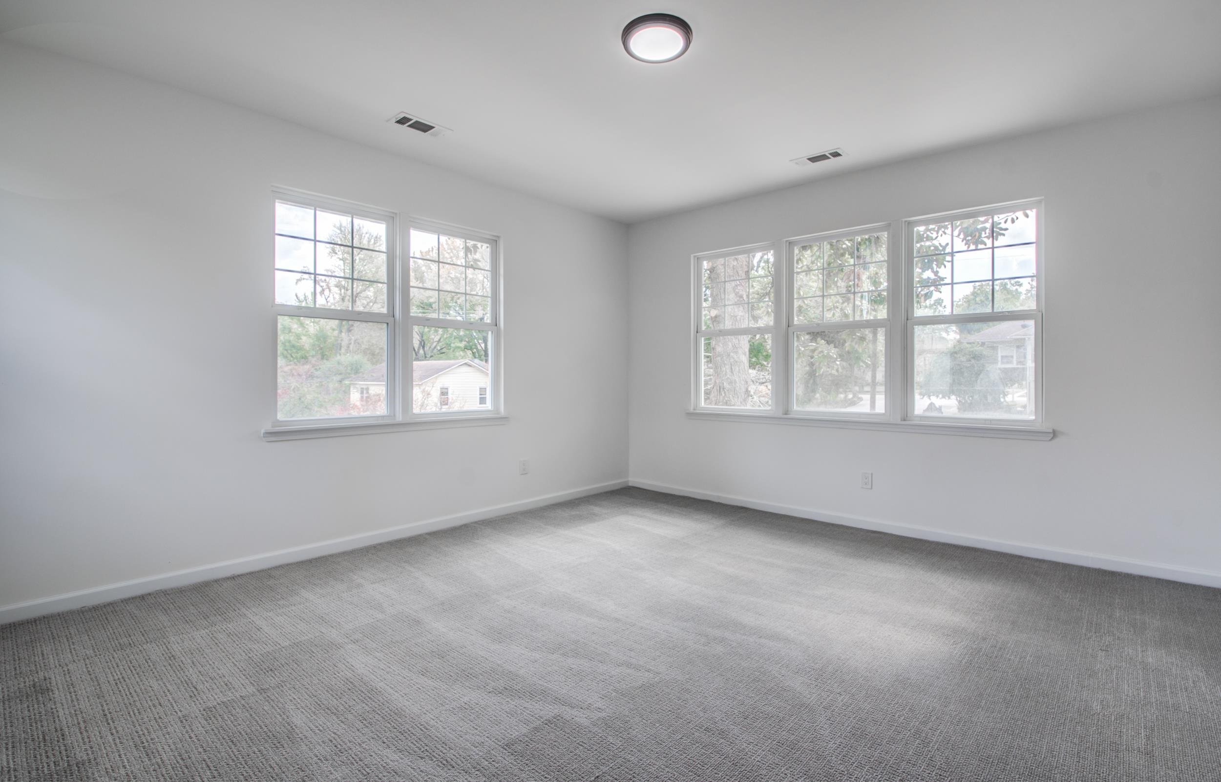 1781 Forest Avenue Memphis, TN 38112 - Photo 17 of 30 Unfurnished room featuring baseboards and light colored carpet