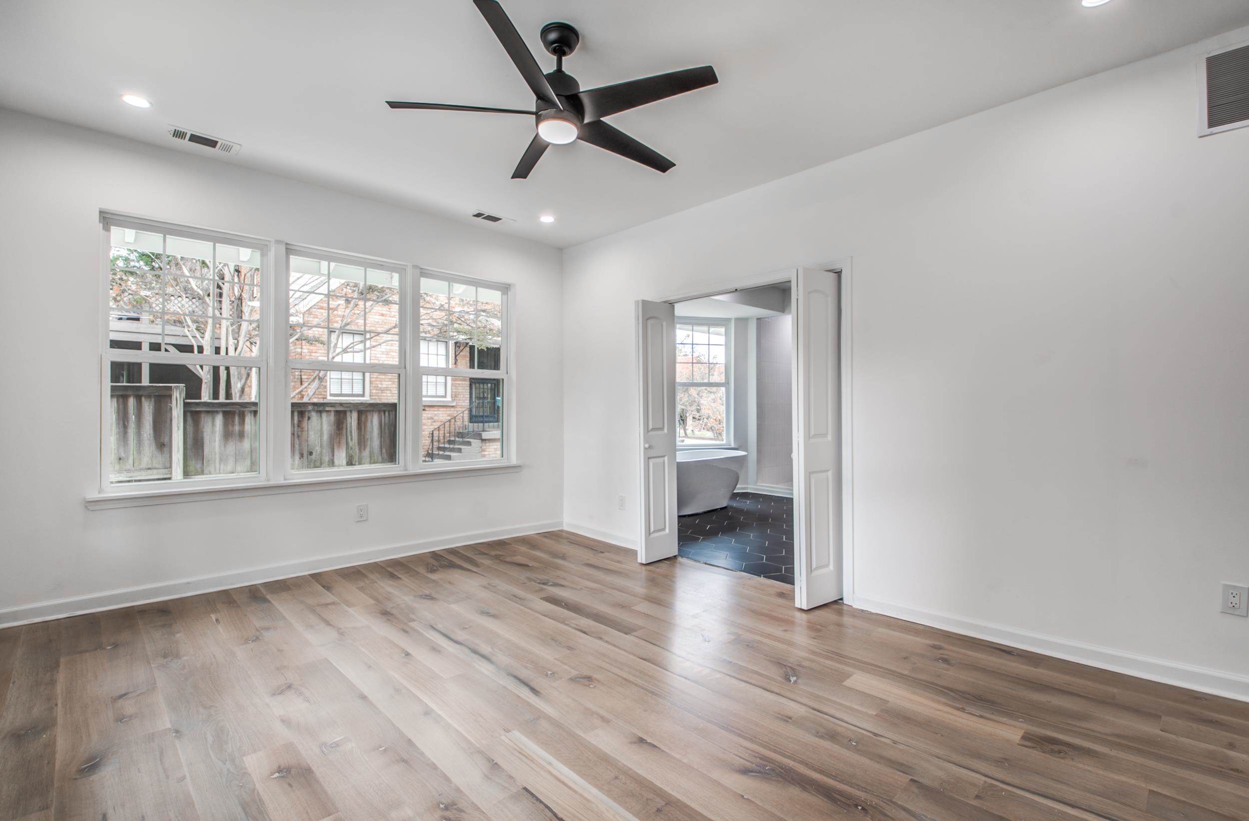 1781 Forest Avenue Memphis, TN 38112 - Photo 21 of 30 Spare room with light wood-type flooring, a ceiling fan, and recessed lighting