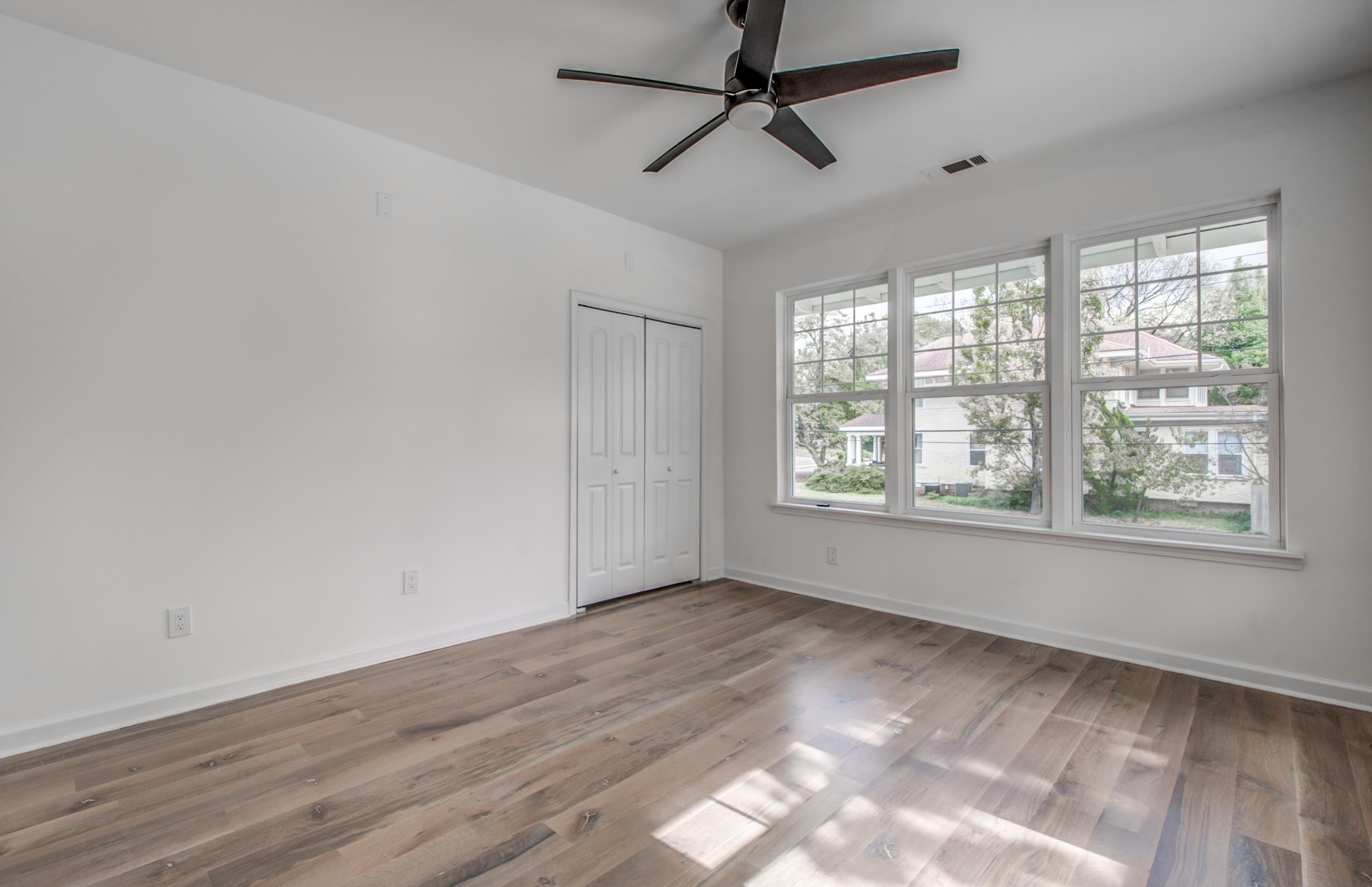 1781 Forest Avenue Memphis, TN 38112 - Photo 23 of 30 Unfurnished bedroom with light wood-style floors, ceiling fan, and a closet