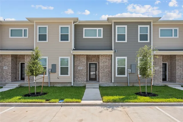 an empty room with windows and entryway