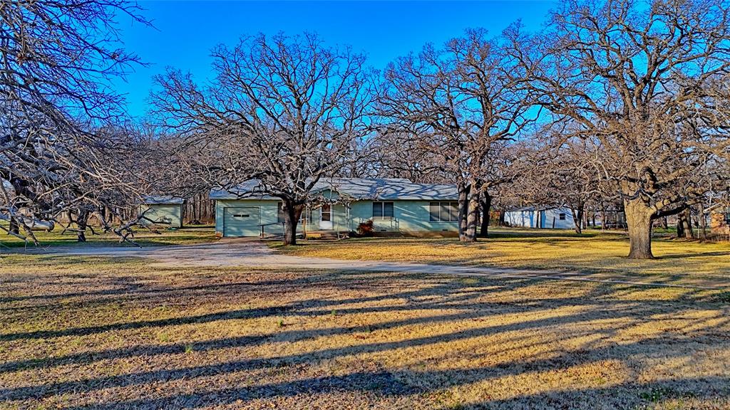 449 Olde Towne Road Paradise, TX 76073 - Photo 1 of 23 a view of a house with a large trees