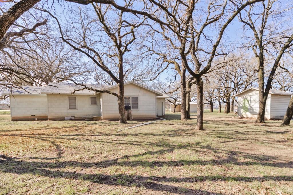 449 Olde Towne Road Paradise, TX 76073 - Photo 18 of 23 a house that has a tree in front of it