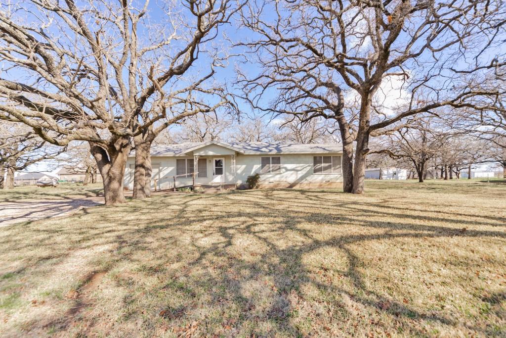 449 Olde Towne Road Paradise, TX 76073 - Photo 23 of 23 a view of a yard with a trees
