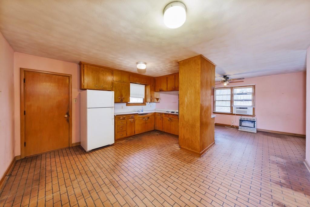 449 Olde Towne Road Paradise, TX 76073 - Photo 6 of 23 a view of a kitchen with furniture and wooden floor