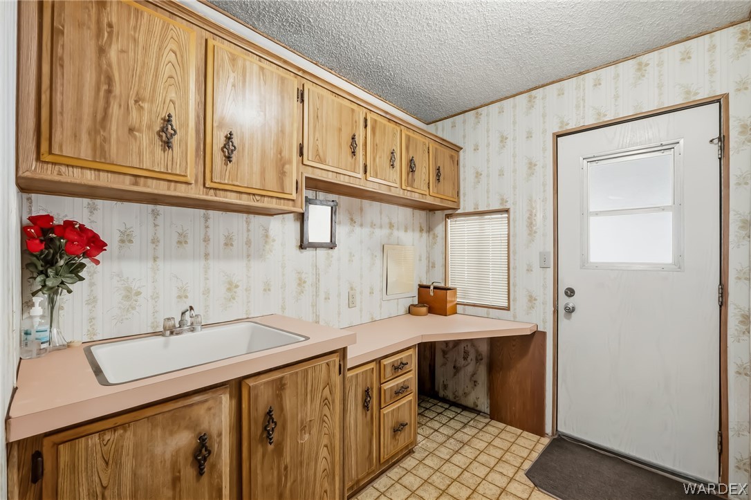 10031 Dike Road Mohave Valley, AZ 86440 - Photo 60 of 78 a bathroom with a sink and a mirror