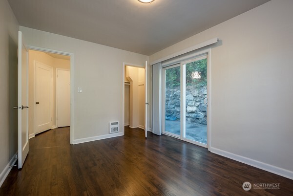 1809 5th Avenue North Seattle, WA 98109 - Photo 23 of 25 wooden floor in an empty room with a window