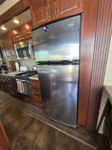 a kitchen with a stove and a microwave