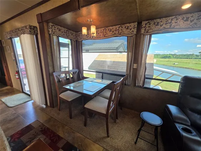 a living room with a couch and a large window