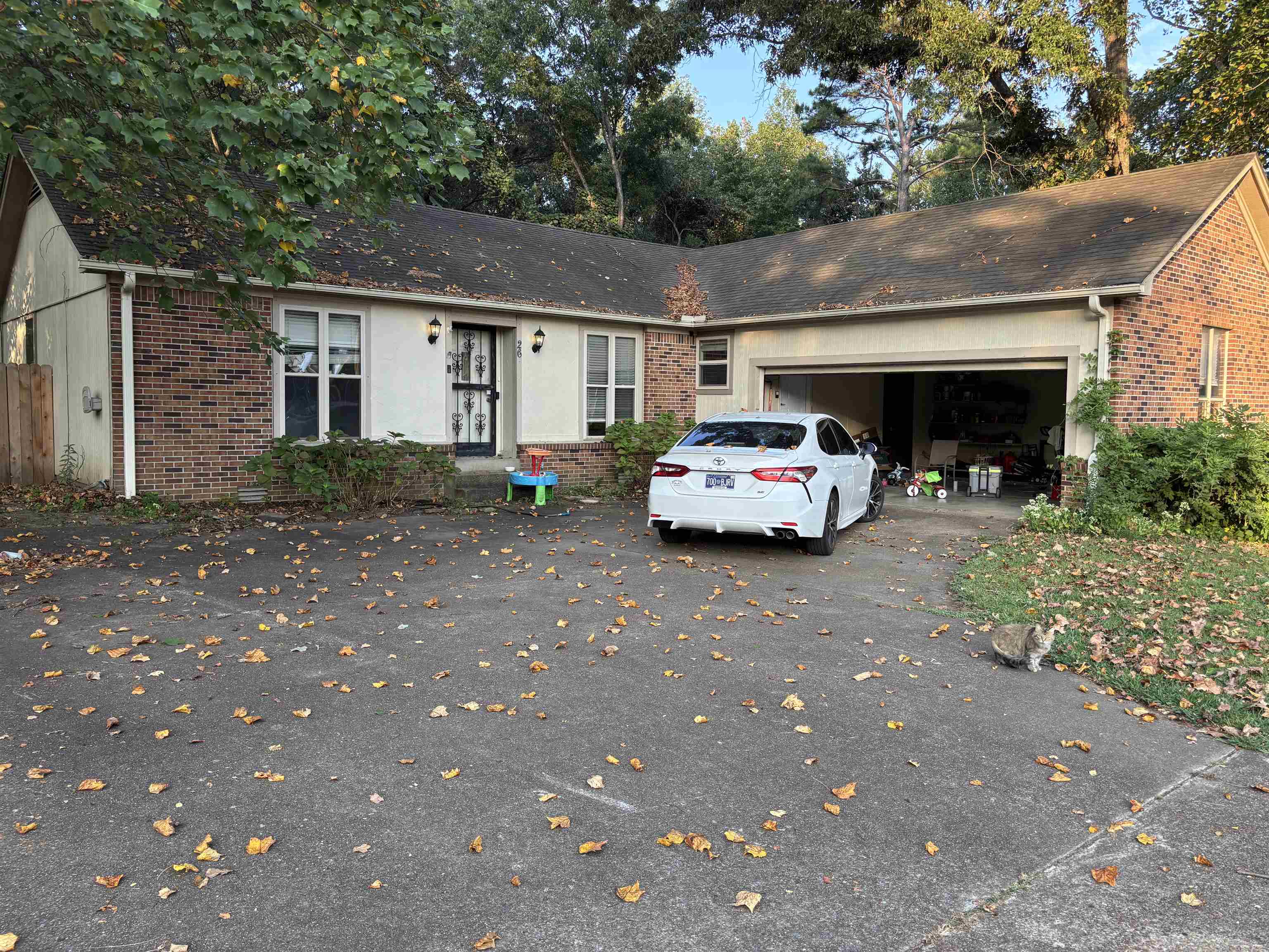 a car parked in front of a house