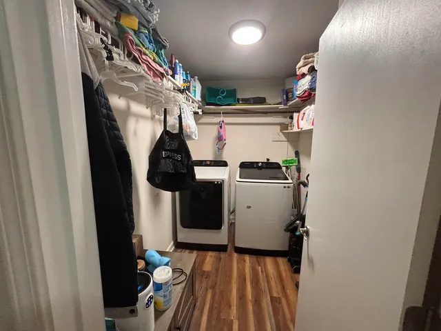 a bed room with a bed and a chandelier