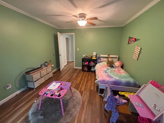 a bed room with a bed and a window