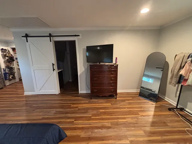 a view of room with furniture and a flat screen tv
