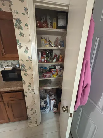 a white toilet sitting next to a bathroom sink