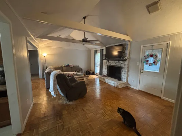 a living room with furniture and a fireplace