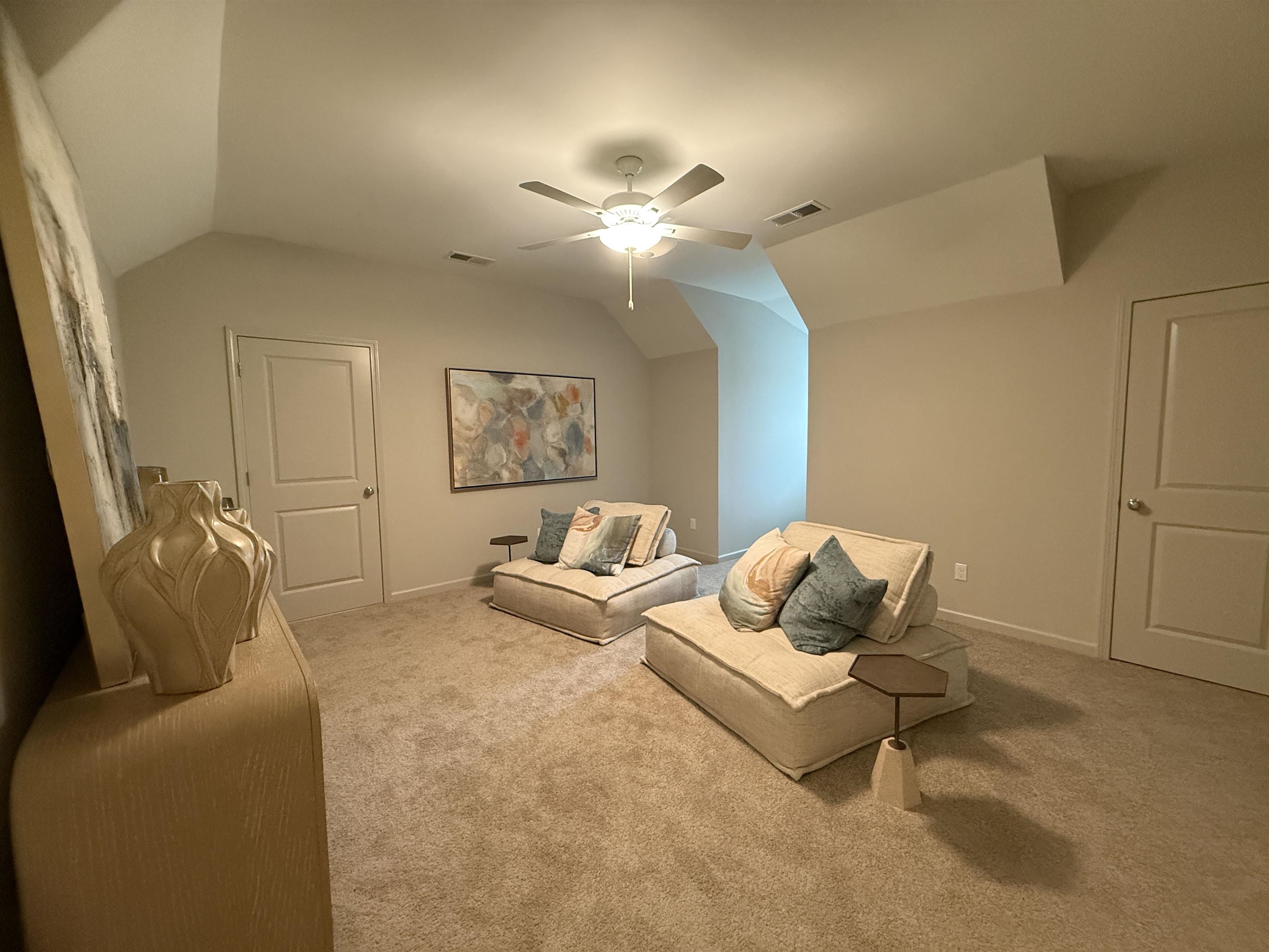 11516 Sunsparkler Way Collierville, TN 38017 - Photo 13 of 24 Living room featuring lofted ceiling, carpet, and a ceiling fan