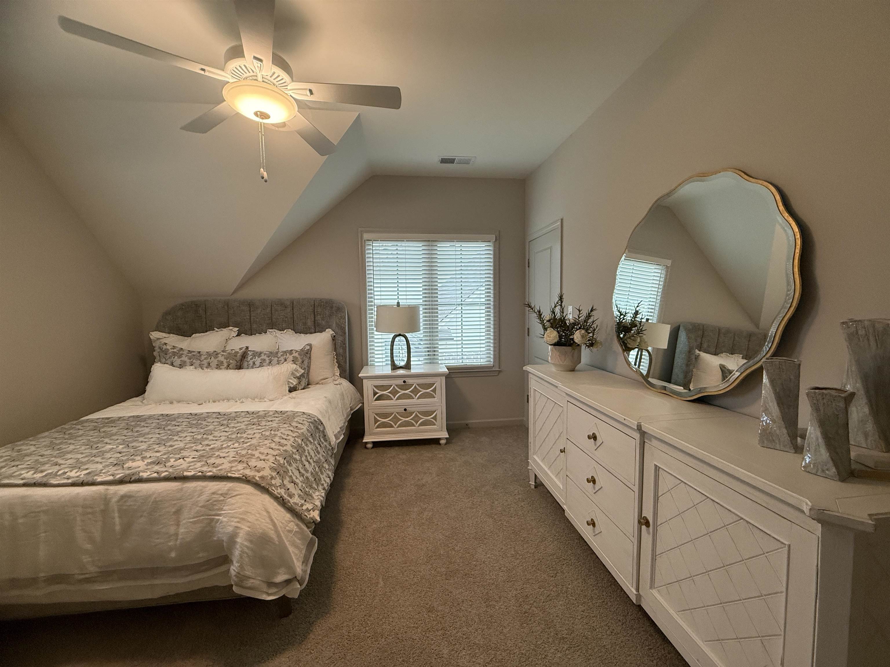 11516 Sunsparkler Way Collierville, TN 38017 - Photo 18 of 24 Bedroom with a ceiling fan, vaulted ceiling, and dark colored carpet