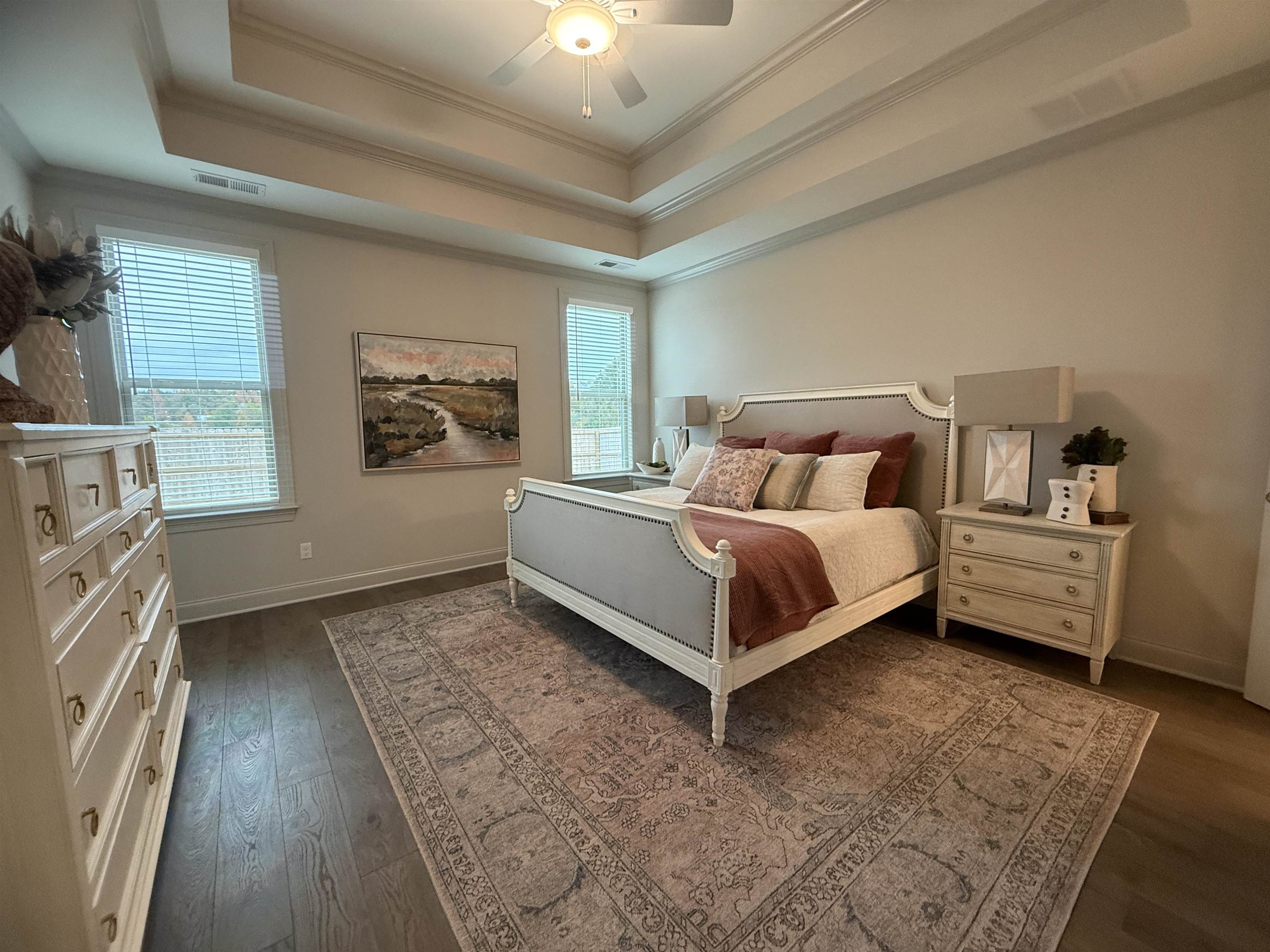 11516 Sunsparkler Way Collierville, TN 38017 - Photo 6 of 24 Bedroom featuring a tray ceiling, ornamental molding, a ceiling fan, and dark wood-style floors