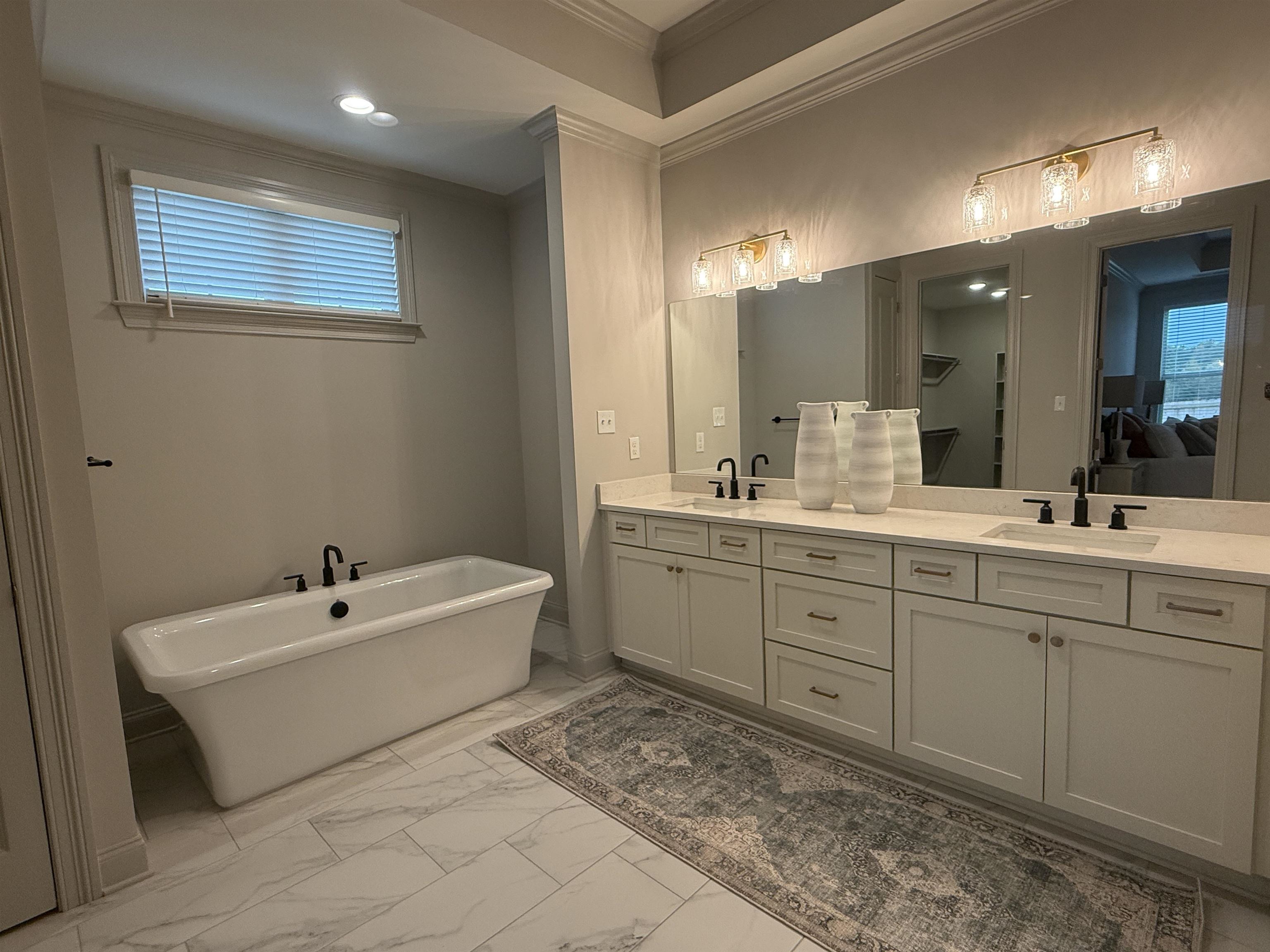 11516 Sunsparkler Way Collierville, TN 38017 - Photo 8 of 24 Bathroom with double vanity, a freestanding tub, crown molding, light marble finish flooring, and recessed lighting