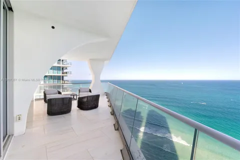 a view of living room with furniture and wooden floor