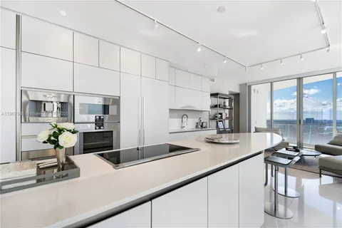 a kitchen with a sink and a counter top space