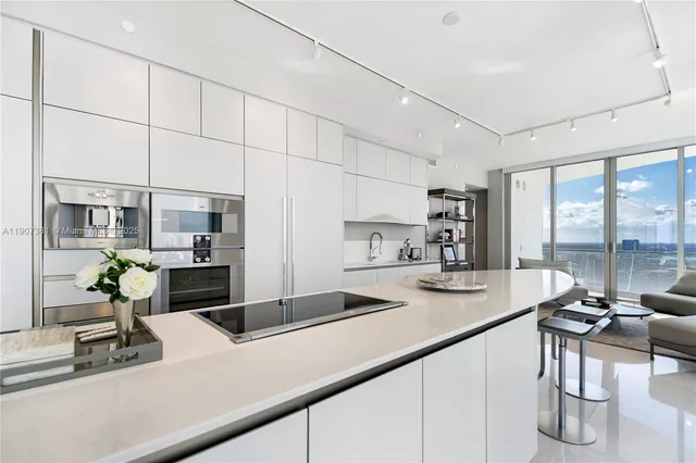 a kitchen with a sink and a counter top space