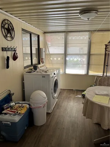 a bathroom with a granite countertop toilet sink and mirror