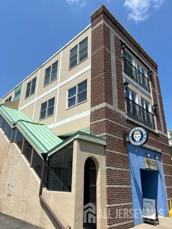 a front view of a building with many windows