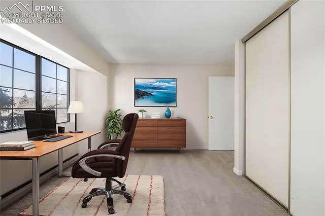 a workspace with furniture and a window