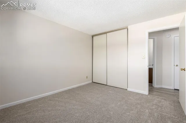 an empty room with a empty space and windows