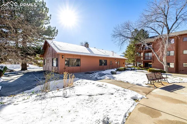 a view of a patio with a bench