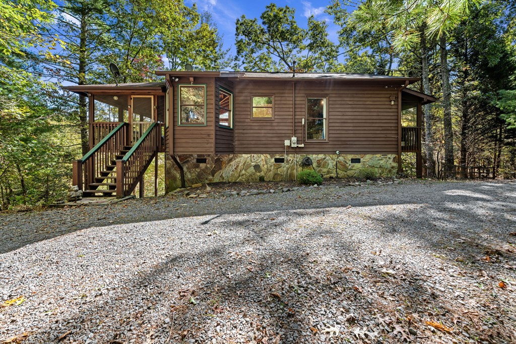 117 Horse Trail Blue Ridge, GA 30513 - Photo 37 of 50 a view of a wooden house with large trees