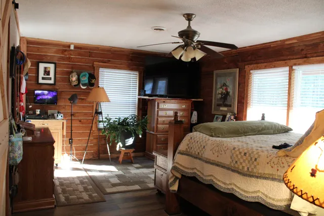 a bedroom with a bed and a dresser