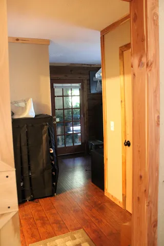 a bedroom with a bed couch and a window