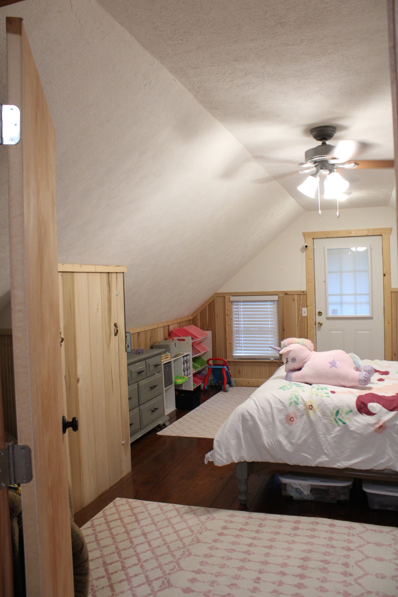 529 Napier Road Lawrenceburg, TN 38464 - Photo 31 of 60 a bedroom with a bed and a chandelier