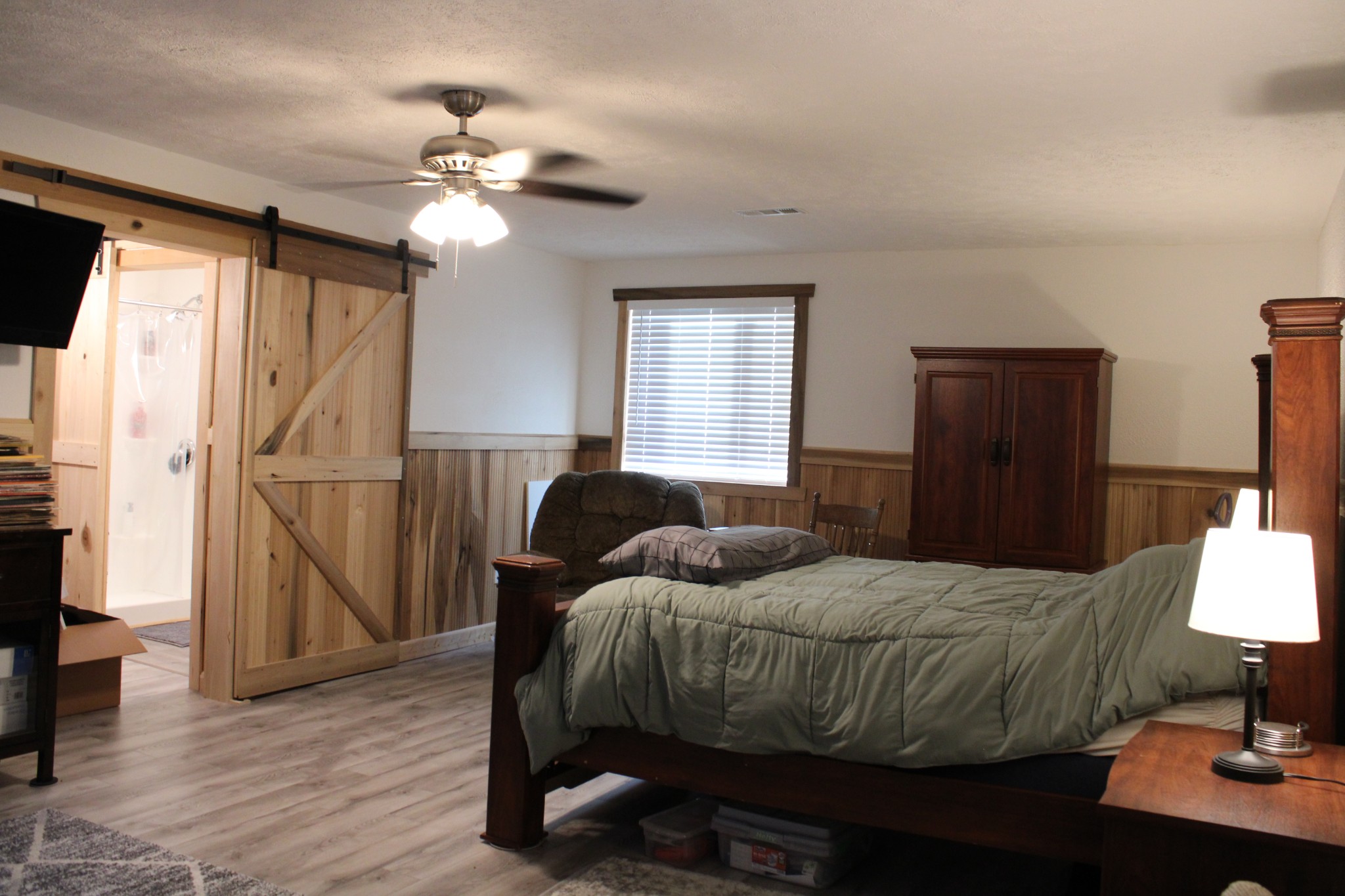529 Napier Road Lawrenceburg, TN 38464 - Photo 42 of 60 a bedroom with a bed and a chandelier