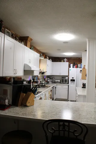 a bathroom with a toilet a sink and a shower