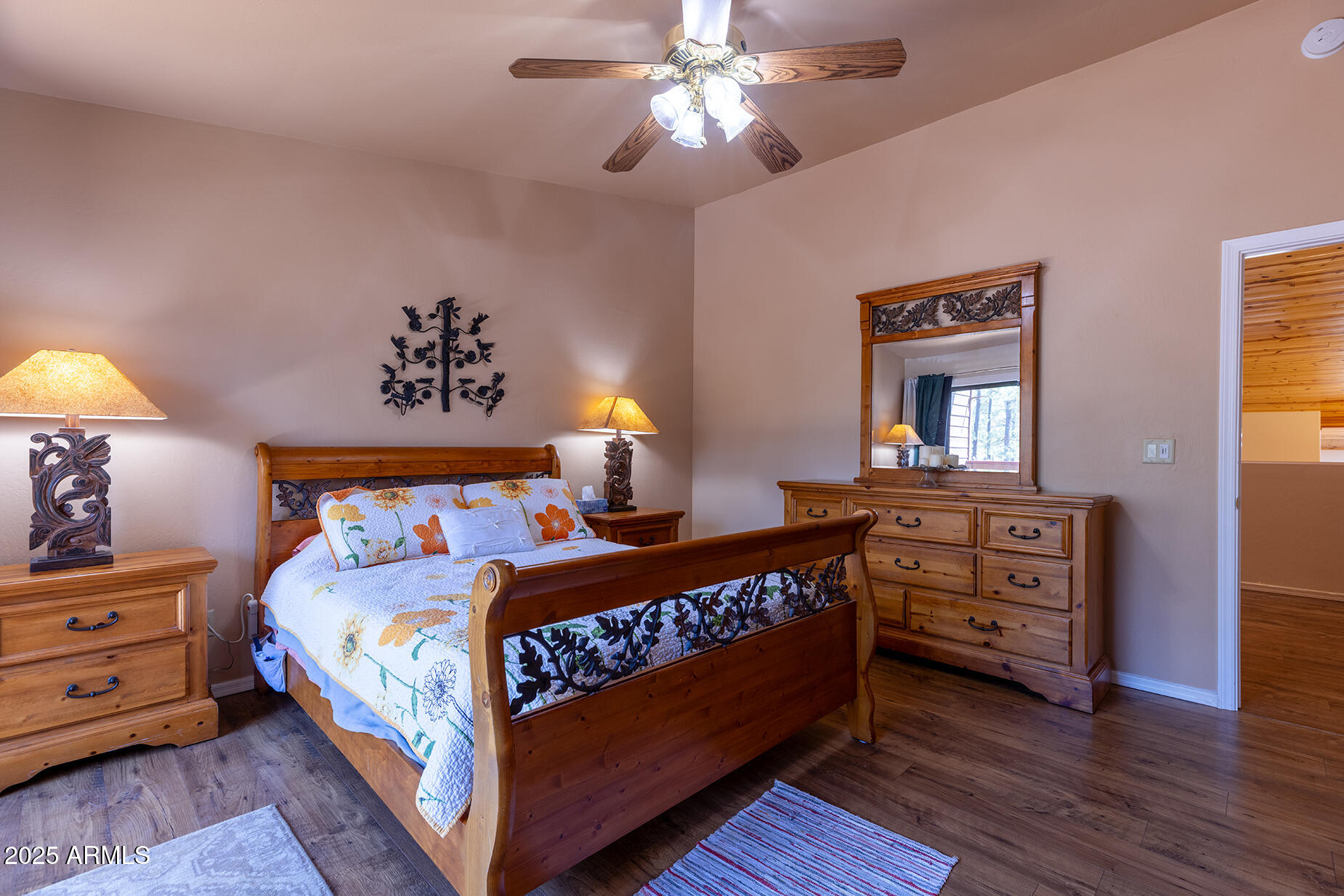 2358 Rainbow Lane Pinetop, AZ 85935 - Photo 32 of 50 a bedroom with a bed and a chandelier