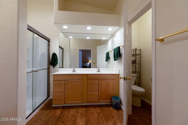 a bathroom with a tub sink and mirror