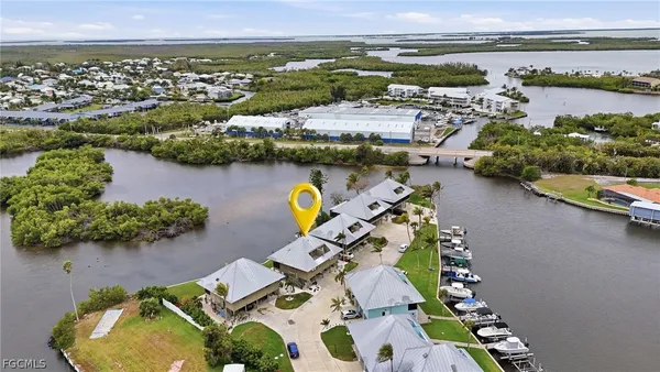 an aerial view of a house with outdoor space
