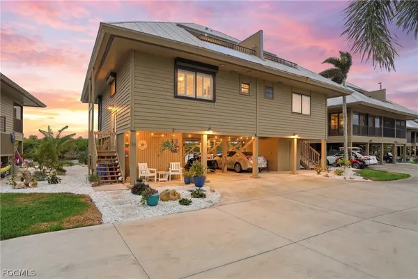 a view of a brick house with a patio