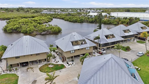 an aerial view of houses with yard