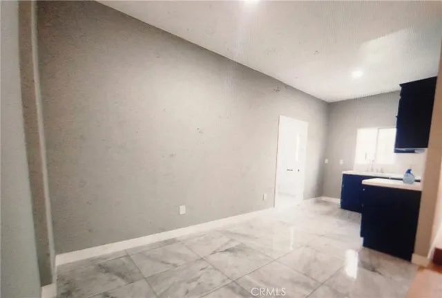 a view of workspace with furniture and flat screen tv