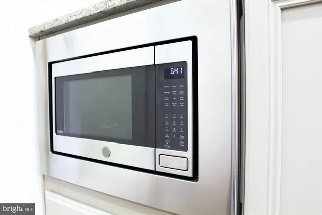 a kitchen with a stove and cabinets