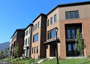 a front view of a building with a yard