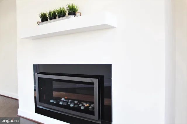 a stove top oven sitting inside of a kitchen