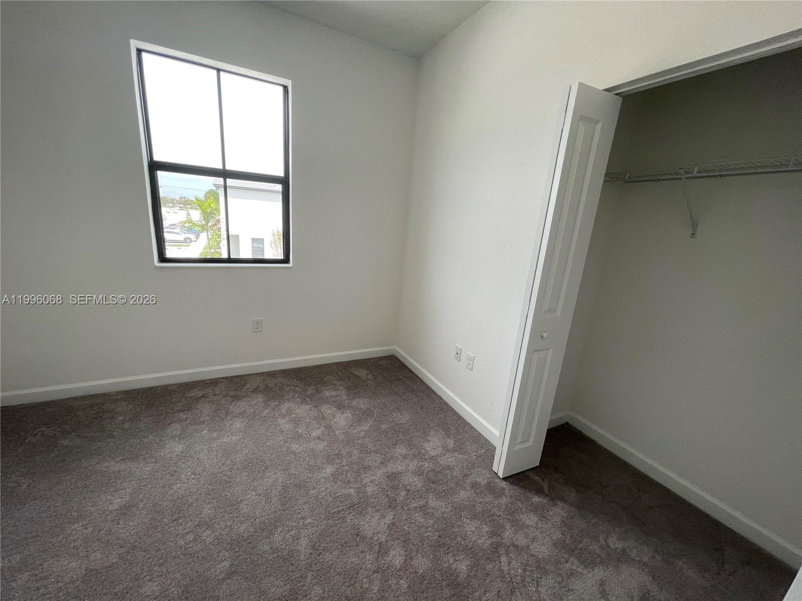 13262 Southwest 287th Terrace Homestead, FL 33033 - Photo 12 of 33 an empty room with a window