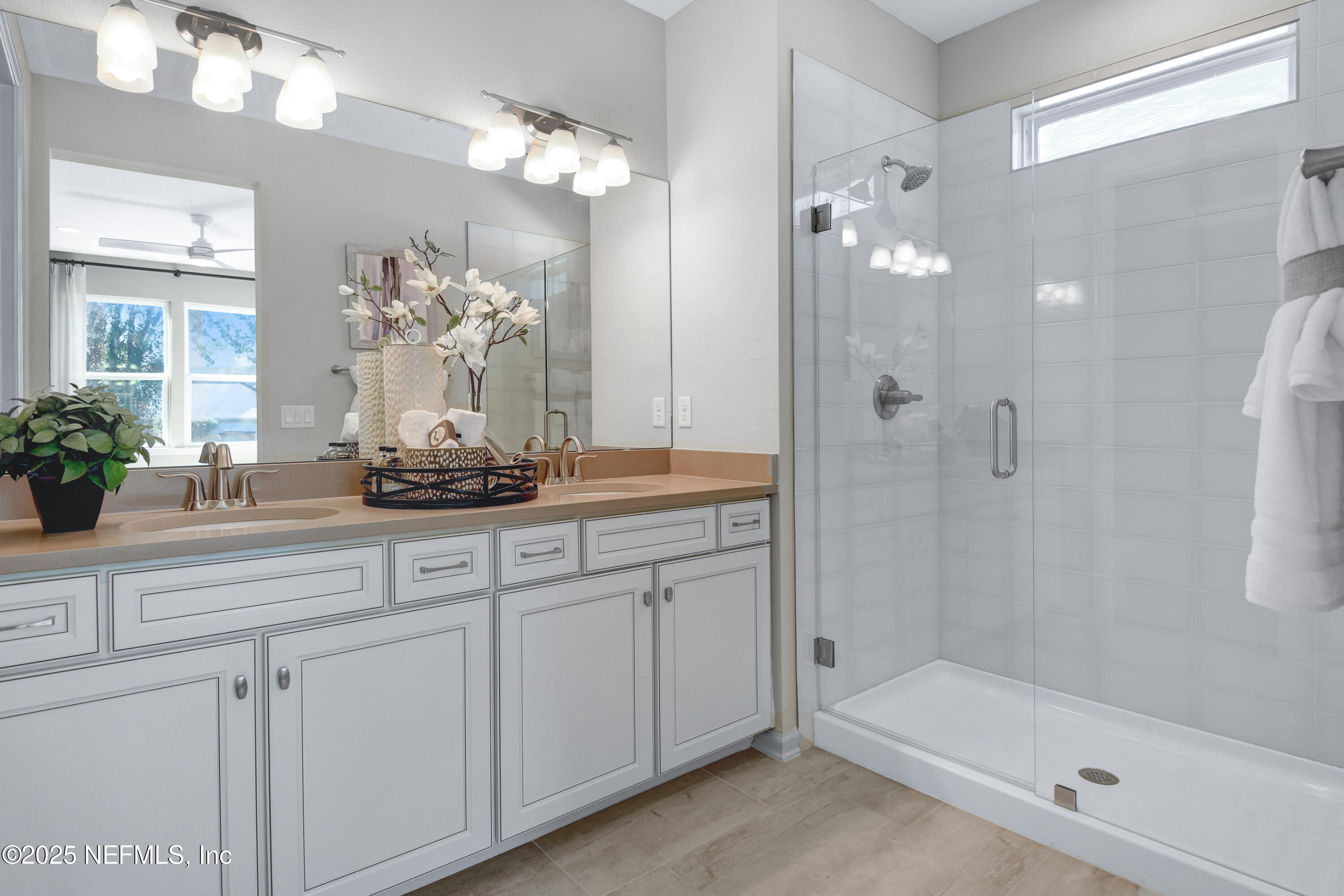 513 White Rabbit Run St. Augustine, FL 32092 - Photo 11 of 35 a bathroom with a double vanity sink mirror and shower