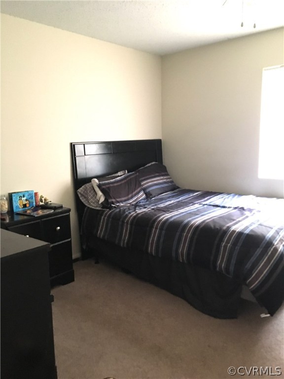 123 Turtle Creek Road, Unit 5 Charlottesville, VA 22901 - Photo 14 of 18 a bedroom with a bed and dresser