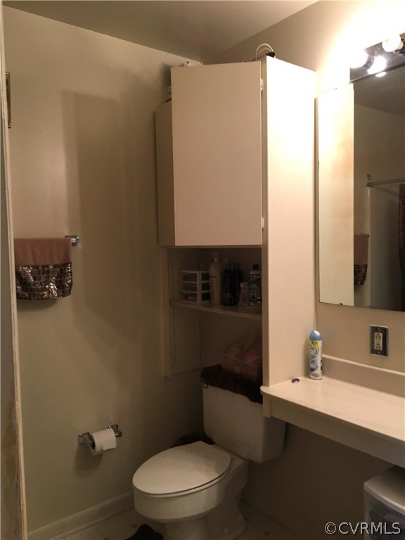123 Turtle Creek Road, Unit 5 Charlottesville, VA 22901 - Photo 15 of 18 a bathroom with a toilet a sink and a mirror